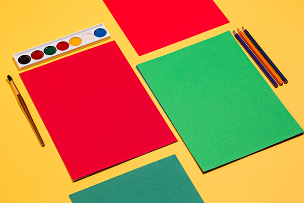The pop art image of colored pencils and colour paper
